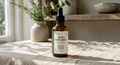 Bottle of Aura Infusion botanical scalp oil.